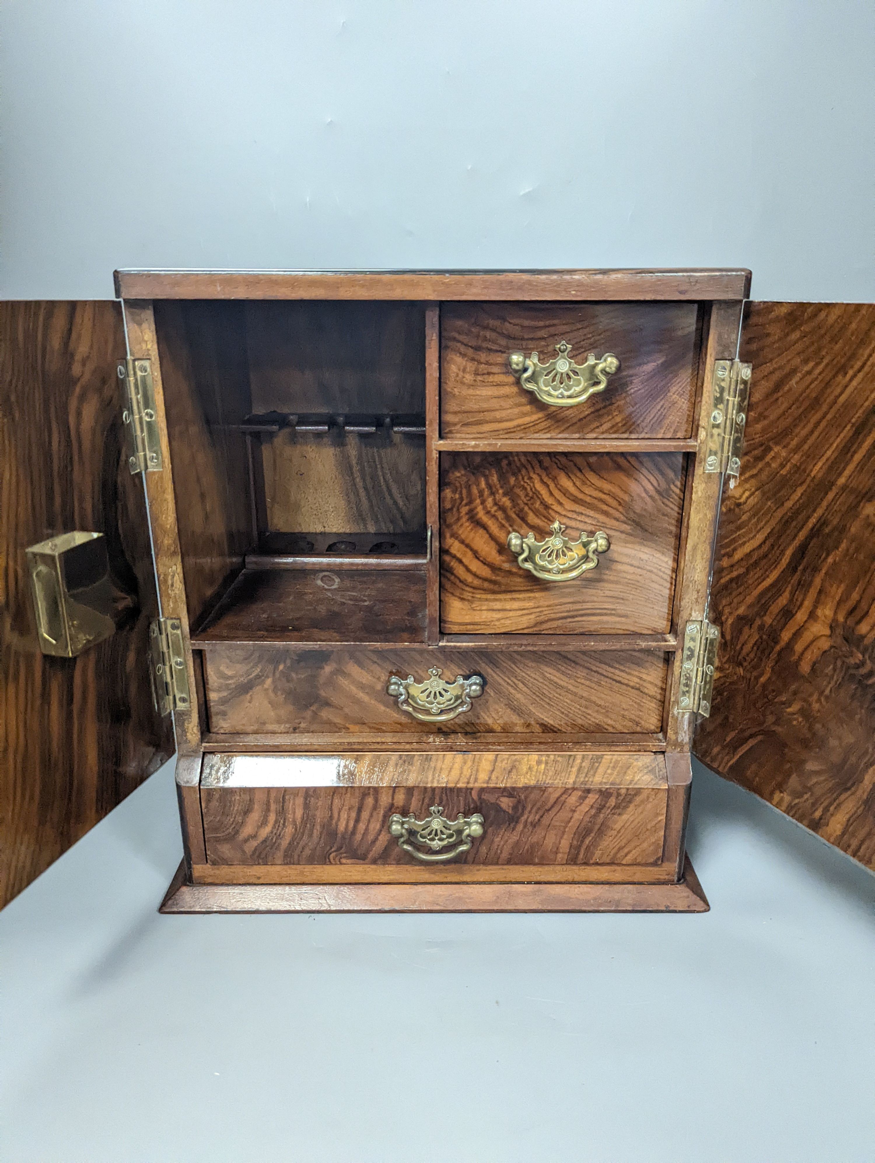 A 19th century mahogany tea caddy and a walnut 2 door smokers cabinet, Smokers cabinet 33 cms high.